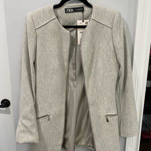 Silver/gray blazer/jacket with silver zippers. New with tags!